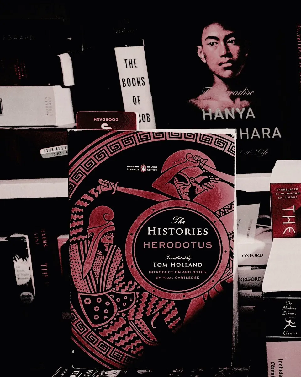 The Histories by Herodotus, propped on a bookshelf